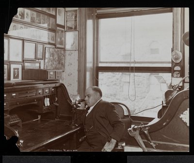 Marshall P. Wilder on the Telephone in His Office, 1898-99 by Byron Company